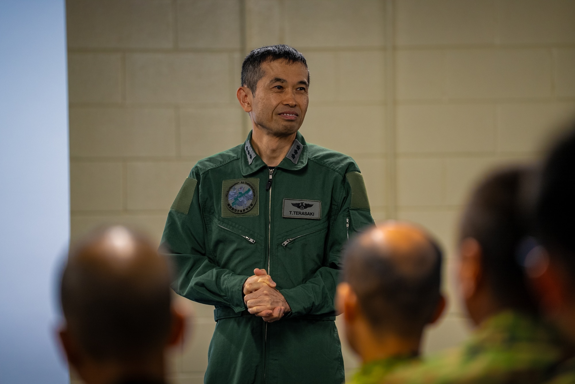 A JASDF general giving closing remarks during a BDOWG conference