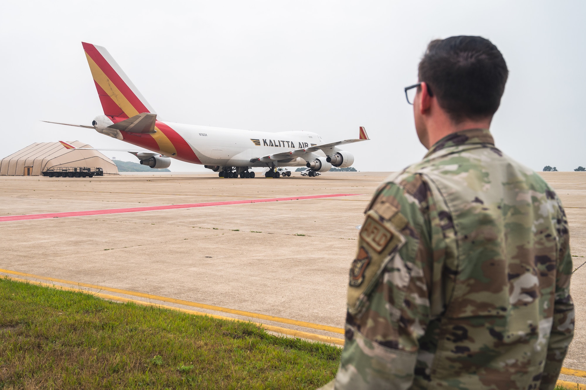 U.S. Air Force Staff Sgt. Jordan Whitworth, 8th Operations Support Squadron airfield management operations supervisor, oversees the flightline.