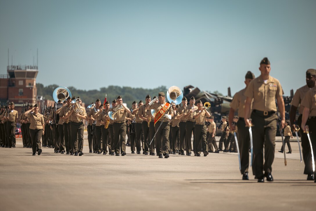 U.S. Marines with 2nd Marine Aircraft Wing Band march in formation during a change of command ceremony on Marine Corps Base Quantico, Virginia, June 21, 2024. U.S. Marine Corps Col. Bradley Harms, the outgoing commanding officer of Marine Helicopter Squadron One, was relieved by Col. Ryan Shadle. (U.S. Marine Corps photo by Lance Cpl. Joaquin Dela Torre)