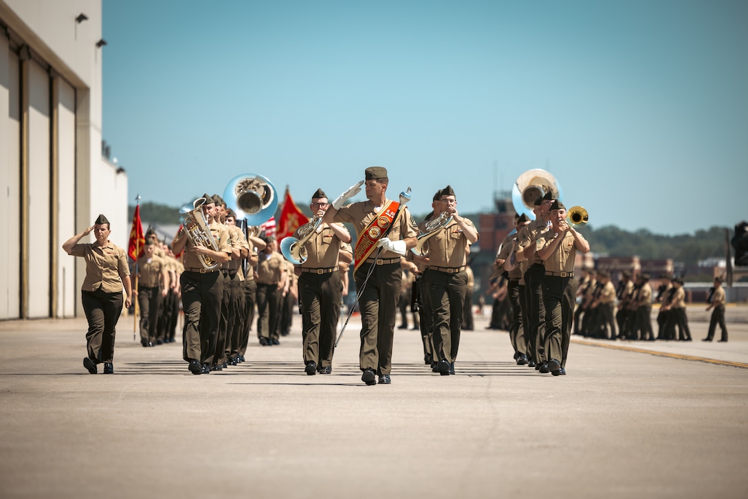 U.S. Marines with 2nd Marine Aircraft Wing Band march in formation during a change of command ceremony on Marine Corps Base Quantico, Virginia, June 21, 2024. U.S. Marine Corps Col. Bradley Harms, the outgoing commanding officer of Marine Helicopter Squadron One, was relieved by Col. Ryan Shadle. (U.S. Marine Corps photo by Lance Cpl. Joaquin Dela Torre)