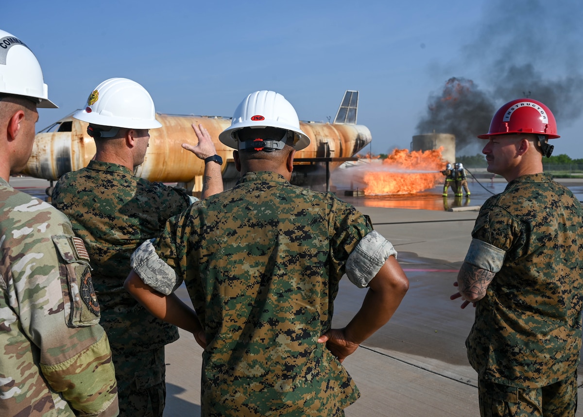 U.S. Marine Corps Lt. Gen. Dimitri Henry, J2 Joint Chiefs of Staff Director for Intelligence, is shown a demonstration of fire training at Goodfellow Air Force Base, June 7, 2024. The 17th Training Wing trains personnel from every branch of the Department of Defense. (U.S. Air Force photo by Senior Airman Zach Heimbuch)