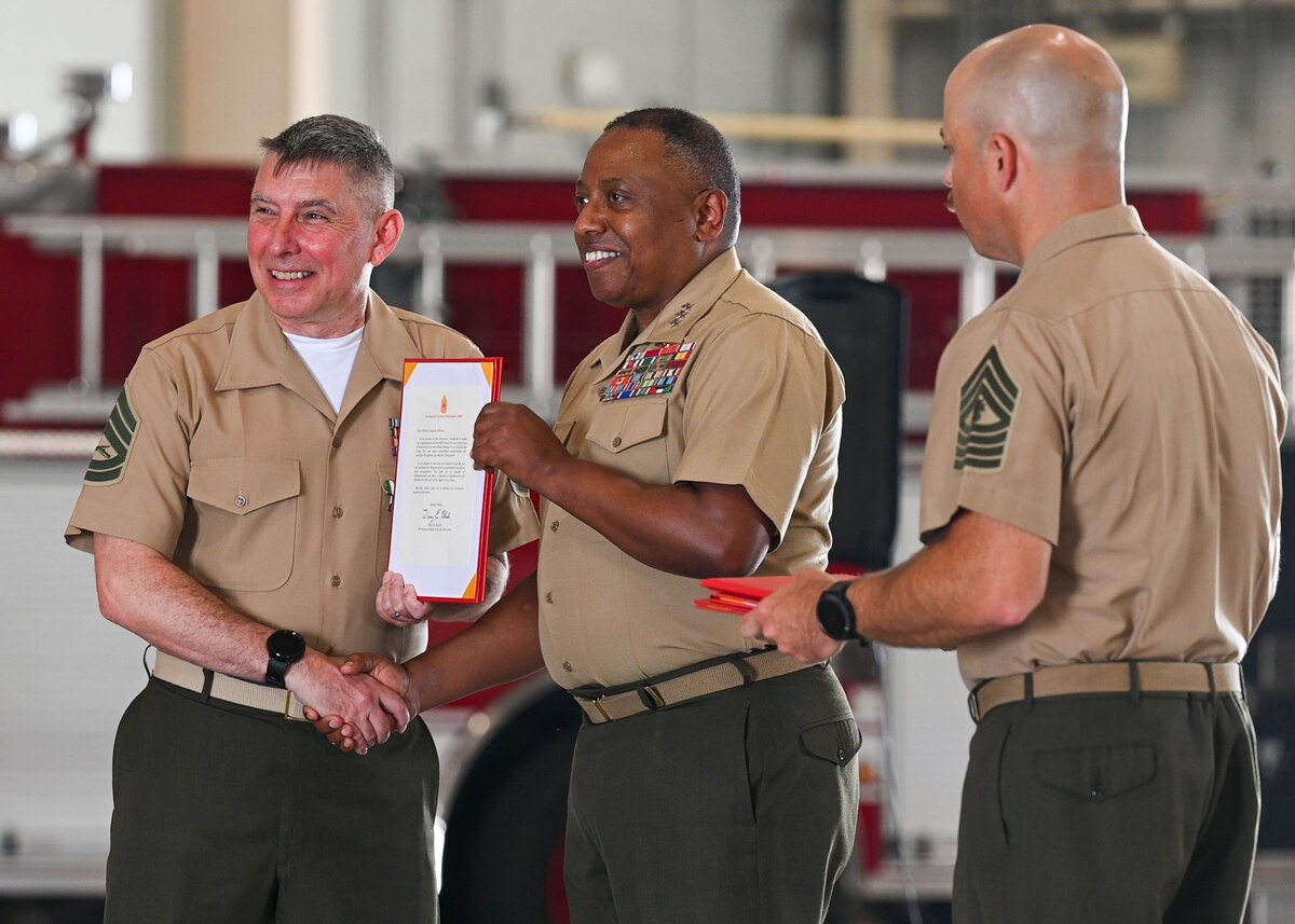 U.S. Marine Corps Lt. Gen. Dimitri Henry, J2 Joint Chiefs of Staff Director for Intelligence, attends Gunnery Sgt. Patrick Pullman’s retirement ceremony at Goodfellow Air Force Base, June 7, 2024. Henry and Pullman both believe students are the seeds that need proper leadership to effectively cultivate the future of service members. (U.S. Air Force photo by Senior Airman Zach Heimbuch)