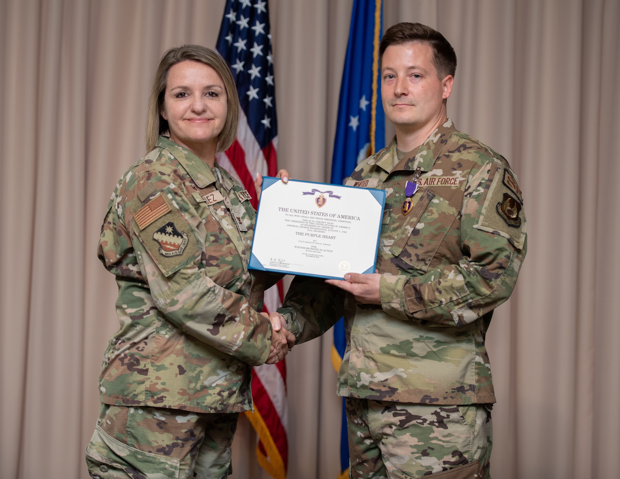 Image of an Airman receiving the Purple Heart.