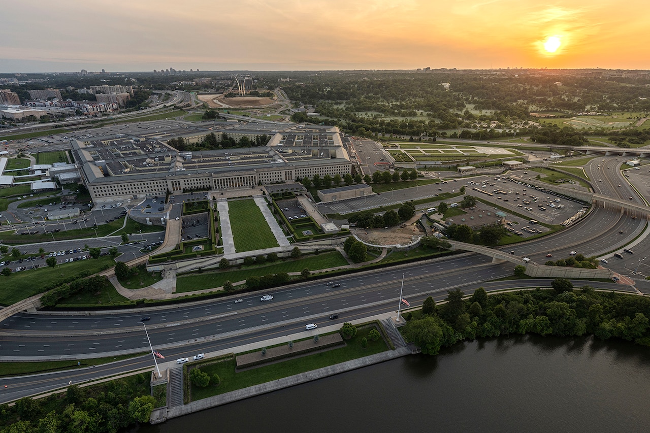 Aerial view of a five-sided building photographed at twilight.