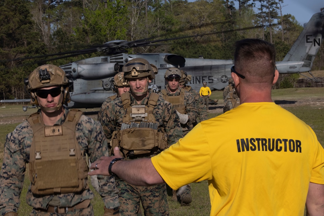 U.S Marine Corps Staff Sgt. Jacob Geigle, a ropes and recovery instructor with II Marine Expeditionary Force, Expeditionary Operations Training Group (EOTG), conducts a head count of the Marines with 26th Marine Expeditionary Unit (MEU) as they complete the Fast Ropes 
Master Course (FRMC) aboard Marine Corps Base Stone Bay North Carolina, March 30, 2023. FRMC is an opportunity for the EOTG to train and certify the 26th MEU as fast rope masters, giving them the ability to expediently descend a rope into restrictive terrain where landing an aircraft is not possible. The EOTG staff consists of close-knit professionals, dedicated to ensuring that deploying MEUs are ready and capable to support geographic combatant commanders and respond to crises events around the globe. (U.S. Marine Corps photo by Cpl. Marc Imprevert)