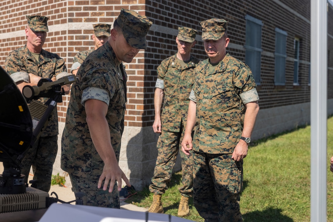 U.S. Marine Corps Lt. Col. Glenn Berdella, left, a communications officer with II Marine Expeditionary Force, briefs equipment specifications to Lt. Gen. James W. Bierman, Jr., right, deputy commandant of Plans Policies and Operations, Headquarters Marine Corps, during a capabilities showcase on Camp Lejeune, North Carolina, June 13, 2024. Bierman visited II Marine Expeditionary Force to view capabilities as they relate to PP&O’s responsibilities of developing and executing plans related to the structure, deployment and employment of Marine Corps Forces. (U.S. Marine Corps photo by Lance Cpl. Jessica J. Mazzamuto)