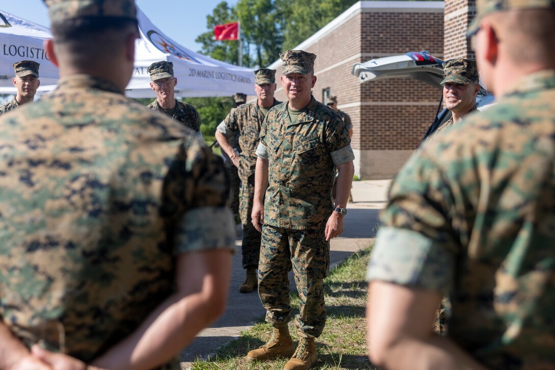 U.S. Marine Corps Lt. Gen. James W. Bierman, Jr., center, deputy commandant of Plans Policies and Operations, Headquarters Marine Corps, speaks with Marines and Sailors of 2nd Marine Logistics Group, during a capabilities showcase on Camp Lejeune, North Carolina, June 13, 2024. Bierman visited II Marine Expeditionary Force to view capabilities as they relate to PP&O’s responsibilities of developing and executing plans related to the structure, deployment and employment of Marine Corps Forces. (U.S. Marine Corps photo by Lance Cpl. Jessica J. Mazzamuto)