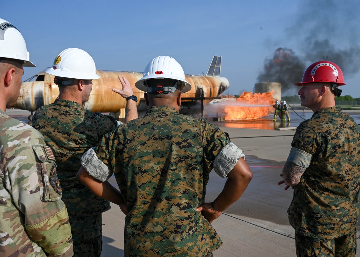 U.S. Marine Corps Lt. Gen. Dimitri Henry, J2 Joint Chiefs of Staff Director for Intelligence, is shown a demonstration of fire training at Goodfellow Air Force Base, June 7, 2024. The 17th Training Wing trains personnel from every branch of the Department of Defense. (U.S. Air Force photo by Senior Airman Zach Heimbuch)
