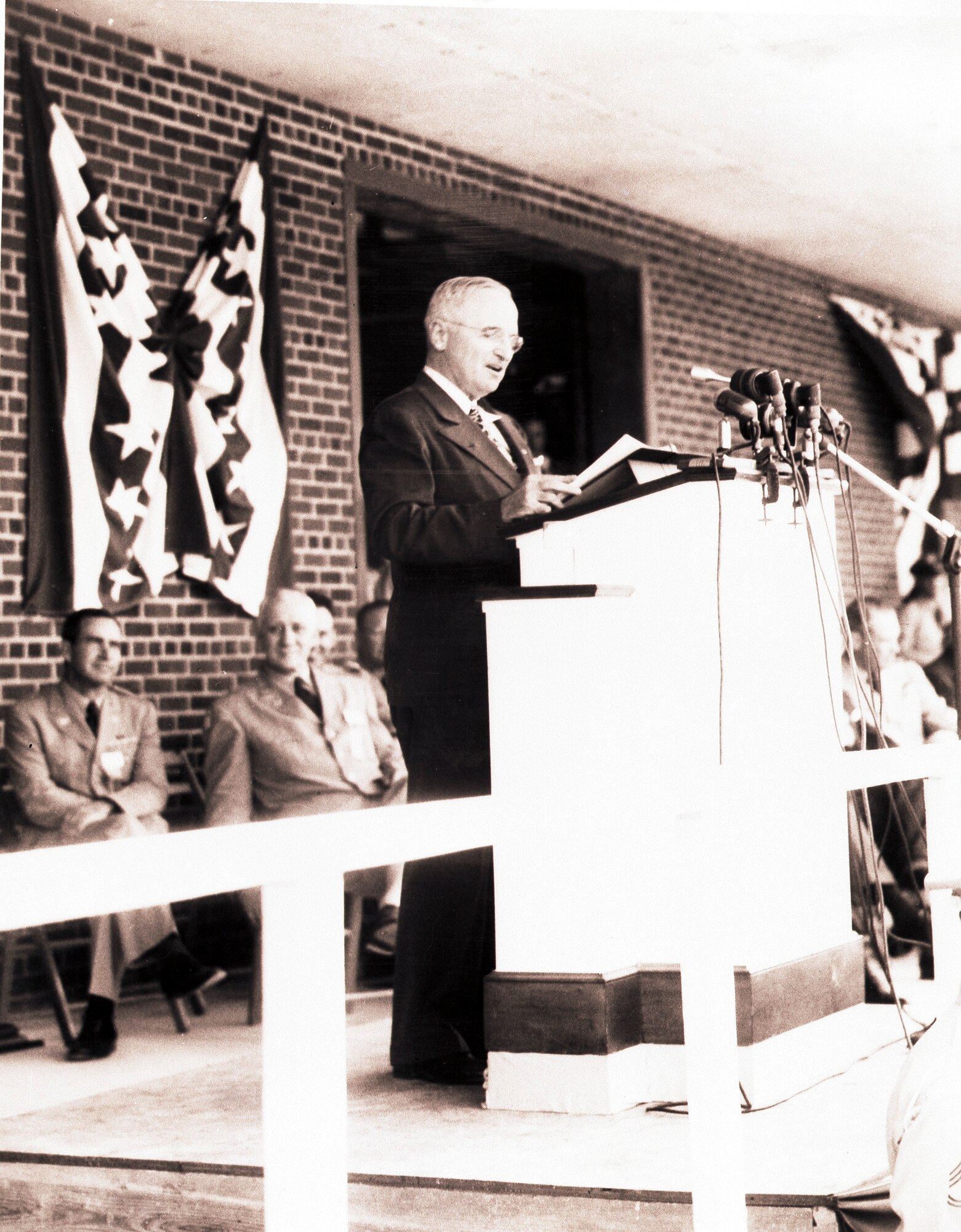 President Harry S. Truman stands on the bay of the Arnold Air Force Base warehouse, the first building constructed on the Tennessee-based installation, delivering his dedication of Arnold Engineering Development Center, June 25, 1951. Truman spoke of AEDC scientists studying what lied on the other side of the speed of sound. He also stated that the effort put forth by those who supported the mission at AEDC would make the United States “the best air power in the world and keep it the best in the world.” (U.S. Air Force photo)