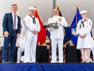 IMAGE: Naval Surface Warfare Center Dahlgren Division Technical Director Dale Sisson Jr., P.E., SES, (left) presented Capt. Philip Mlynarski with a replica of the 11-inch Dahlgren Gun during Mlynarski’s retirement ceremony June 21. Mlynarski who served as NSWCDD’s 47th commanding officer in the final two years of his 26-year career is a lifelong Cubs fan.