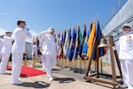 IMAGE: Capt. Philip Mlynarski (center) salutes as he exits his retirement ceremony at Naval Surface Warfare Center Dahlgren Division June 21. Mlynarski served as NSWCDD’s 47th commanding officer in the final two years of his 26-year career.