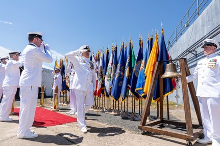 IMAGE: Capt. Philip Mlynarski (center) salutes as he exits his retirement ceremony at Naval Surface Warfare Center Dahlgren Division June 21. Mlynarski served as NSWCDD’s 47th commanding officer in the final two years of his 26-year career.