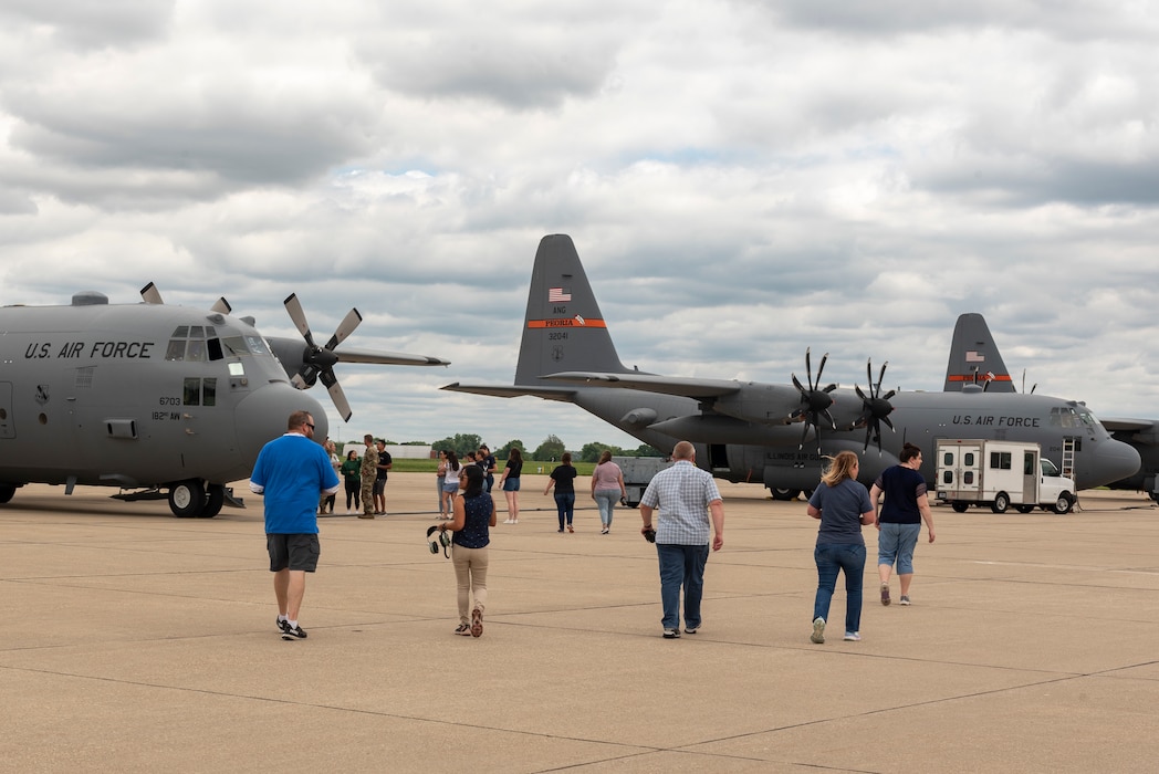 Military spouses on a C-130H Hercules flight.