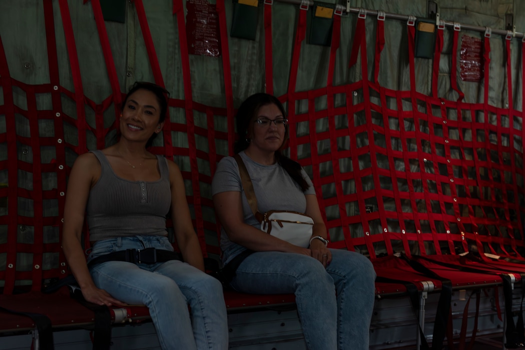 Military spouses on a C-130H Hercules flight.