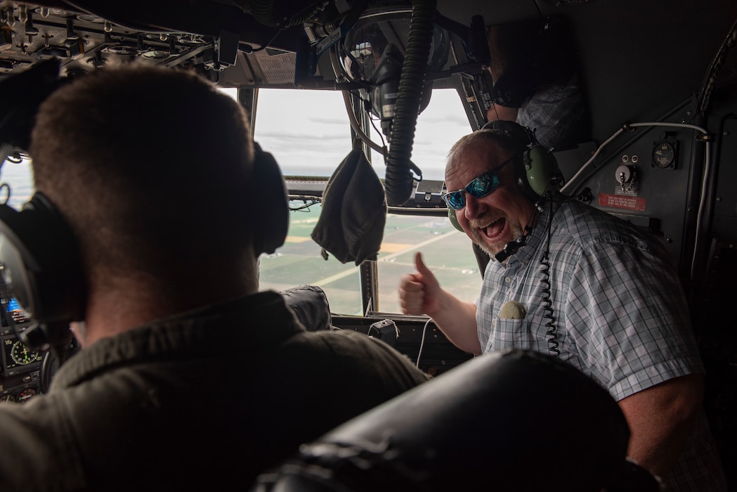 Military spouses on a C-130H Hercules flight.