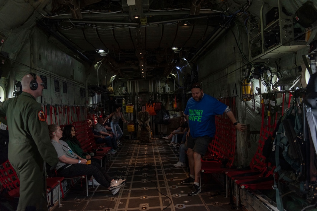 Military spouses on a C-130H Hercules flight.