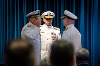 WASHINGTON -- Rear Adm. Todd M. Evans salutes Rear Adm. Thomas J. Dickinson as he assumes command during the Naval Sea Systems Command Warfare Centers change of command, held June 24 at the Washington Navy Yard.  

Vice Adm. Jim Downey, commander, Naval Sea Systems Command (center) presided over the ceremony. 

The NAVSEA Warfare Centers execute research, development, test and evaluation efforts for the future Navy as well as provide in-service engineering and logistics support for the operational surface and submarine forces.