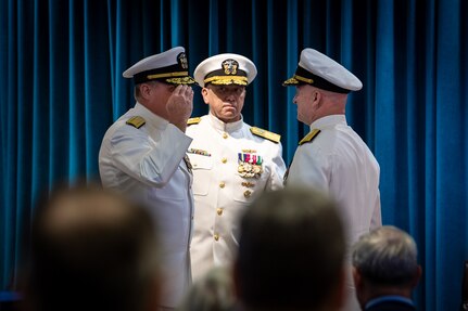 WASHINGTON -- Rear Adm. Todd M. Evans salutes Rear Adm. Thomas J. Dickinson as he assumes command during the Naval Sea Systems Command Warfare Centers change of command, held June 24 at the Washington Navy Yard.  

Vice Adm. Jim Downey, commander, Naval Sea Systems Command (center) presided over the ceremony. 

The NAVSEA Warfare Centers execute research, development, test and evaluation efforts for the future Navy as well as provide in-service engineering and logistics support for the operational surface and submarine forces.