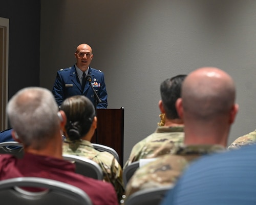 U.S. Air Force Maj. Alan Geason, incoming 17th Communications Squadron commander, speaks during his assumption of command ceremony at the Powell Event Center, Goodfellow Air Force Base, Texas, June 20, 2024. The 17th CS welcomed Geason to their mission to operate, secure and defend cyberspace systems to enable training of intelligence, surveillance, reconnaissance and fire protection professionals for America and its allies. (U.S. Air Force photo by Senior Airman Zach Heimbuch)