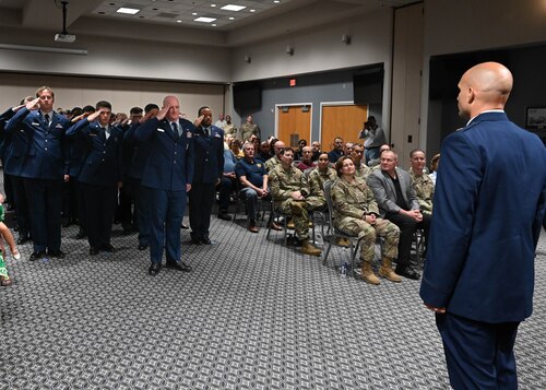 Members of the 17th Communications Squadron salute U.S. Air Force Maj. Alan Geason, incoming 17th CS commander, during the assumption of command ceremony at the Powell Event Center, Goodfellow Air Force Base, Texas, June 20, 2024. The first salute represents the squadron welcoming its new commander. (U.S. Air Force photo by Senior Airman Zach Heimbuch)