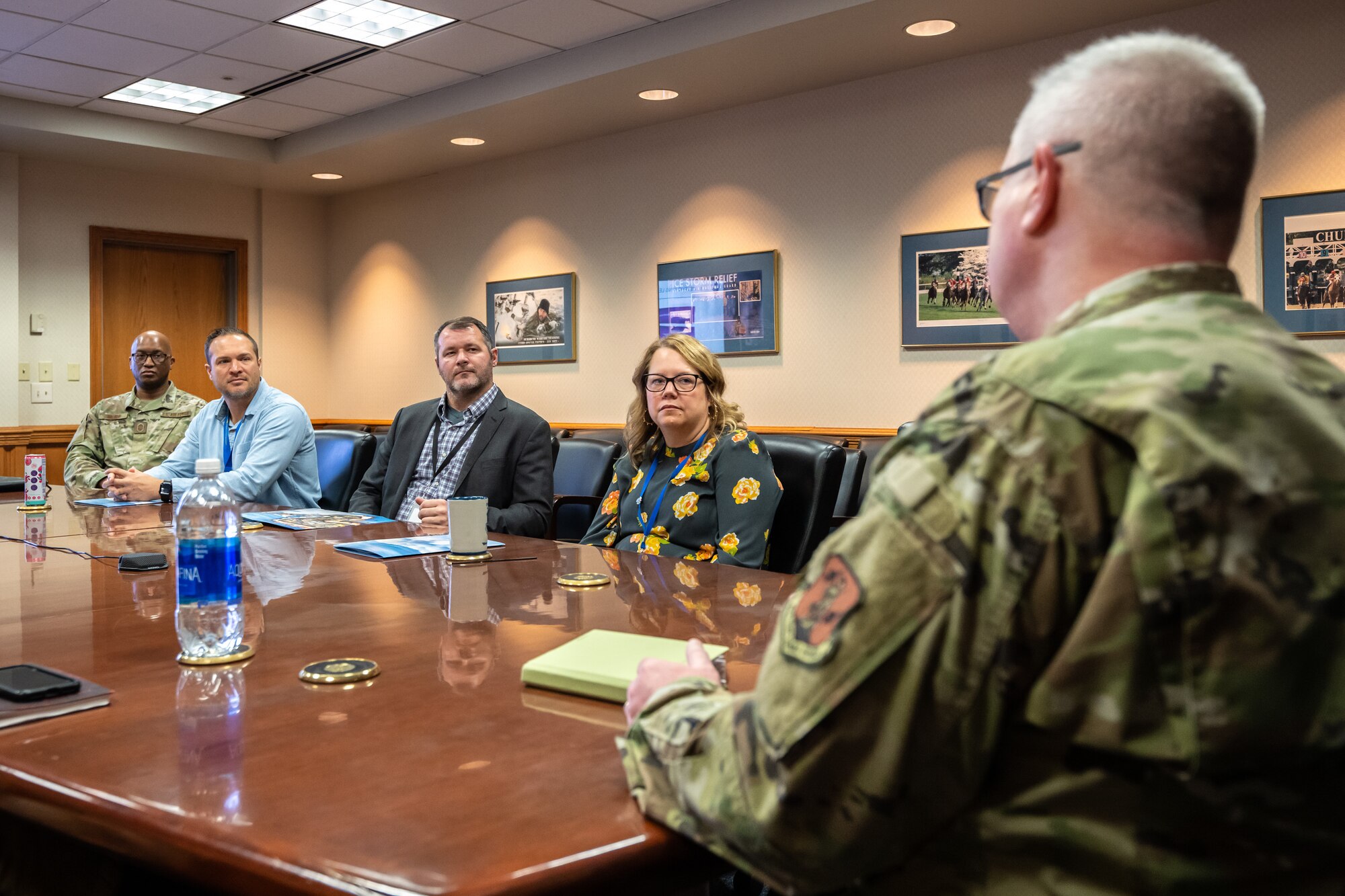 Brig. Gen. David Mounkes, right, the Kentucky National Guard’s assistant adjutant general for Air, briefs administrators from Jefferson County Public Schools about career opportunities for graduating high schoolers at the Kentucky Air National Guard base in Louisville, Ky., March 14, 2024. Attending the briefing were, left to right, James Moore, instructional lead; Beau Johnston, director of career and technical education; and Mary Louise Pozaric, director of post-secondary planning. (U.S. Air National Guard photo by Dale Greer)