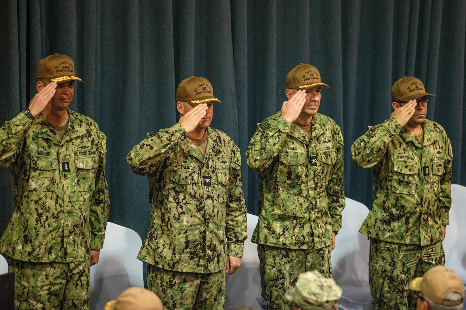 From left to right, Vice Adm. Nathan Moore, commander, Atlantic Area, Capt. Capt. John McTamney IV, commodore of Patrol Forces Southwest Asia, Capt. Joseph Camp, prospective commodore of PATFORSWA, and Master Chief Petty Officer Anthony Martinez, PATFORSWA command master chief, salute during a change-of-command ceremony, June 18, 2024, in Manama, Bahrain. PATFORSWA’s mission is to equip, deploy and support mission ready Coast Guard forces to conduct maritime operations across the Middle East for United States Central Command. (U.S. Army photo by Sgt. Julio Hernandez)