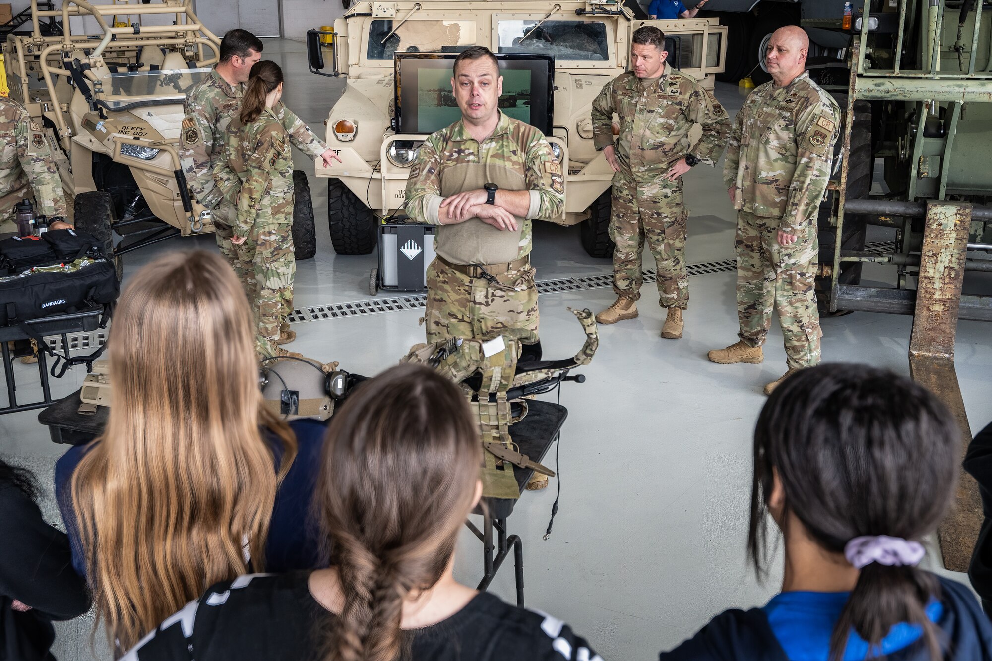 Master Sgt. Brian Milburn, a loadmaster assigned to the 123rd Airlift Wing, talks to students from Nelson County High School’s Air Force JROTC program about contingency- and disaster-response missions during their tour of the Kentucky Air National Guard Base in Louisville, Ky., March 14, 2024. The base is home to about 1,200 Airmen and eight C-130J Super Hercules aircraft, with missions spanning the gamut from tactical airlift, special operations, disaster response, explosive ordnance disposal and aircraft maintenance to civil engineering, cyber communications, security forces, medical care and logistics. (U.S. Air National Guard photo by Dale Greer)