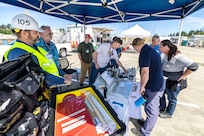 Washington Emergency Management Division employees, left, listen to a presentation on radiological emergency planning June 6, 2024, during a command visit for state, county and local emergency management partners on Naval Base Kitsap in Bremerton, Washington. (U.S Navy photos by Jeb Fach)