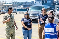 Lt. Cmdr. Emanuel Towns II, USS San Juan (SSN 751), conducts a submarine tour for Washington Emergency Management Division employees June 6, 2024, at Puget Sound Naval Shipyard & Intermediate Maintenance Facility in Bremerton, Washington. (U.S. Navy photo by Jeb Fach)