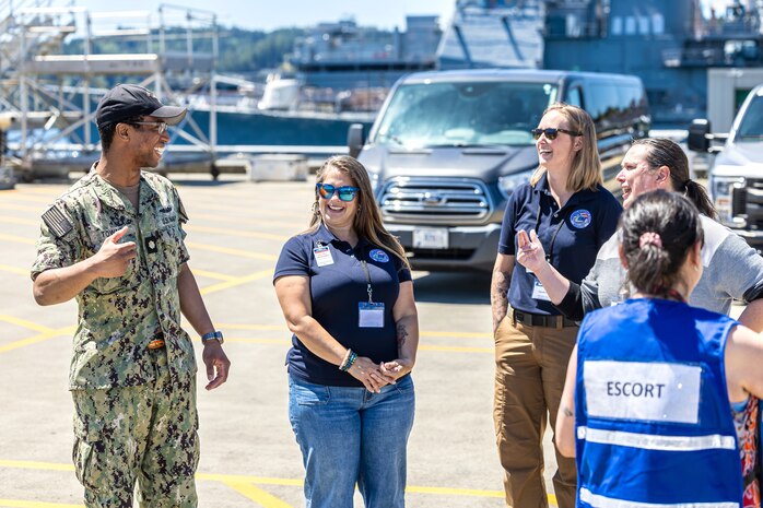 Lt. Cmdr. Emanuel Towns II, USS San Juan (SSN 751), conducts a submarine tour for Washington Emergency Management Division employees June 6, 2024, at Puget Sound Naval Shipyard & Intermediate Maintenance Facility in Bremerton, Washington. (U.S. Navy photo by Jeb Fach)