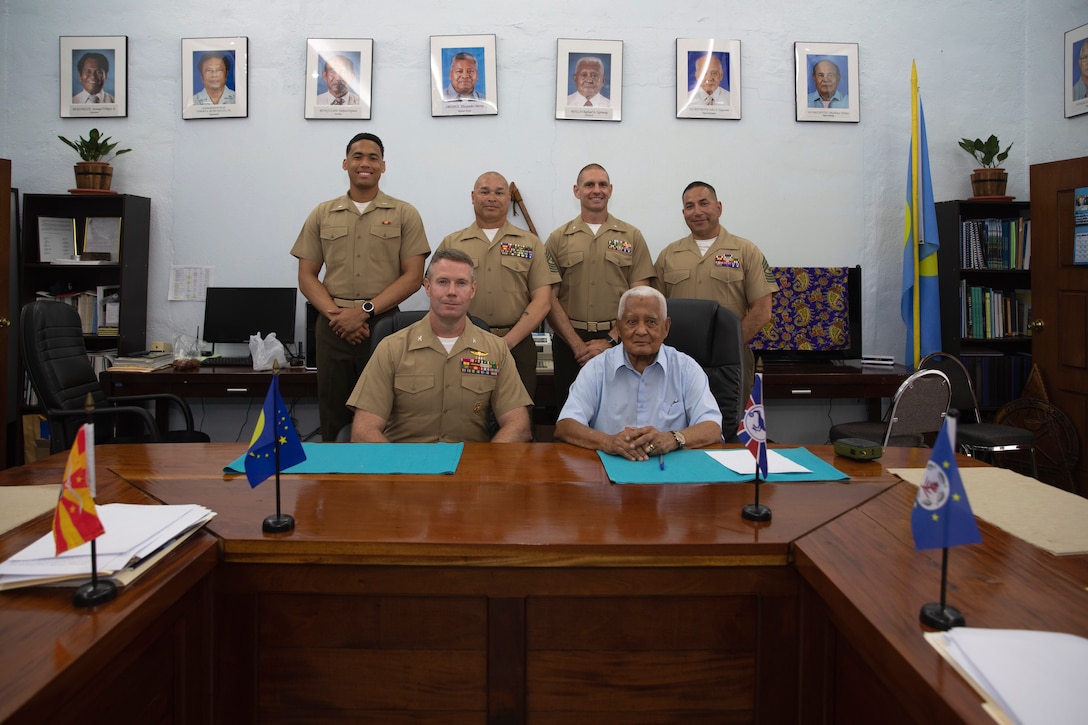 U.S. Marines with Combat Logistics Battalion 13, Combat Logistics Regiment 17, 1st Marine Logistics Group, and with CLR-17, pose for a picture with Chief Reklai Raphael Ngirmang, Palau’s paramount high chief, and a retired U.S. Marine Corps Vietnam War veteran, during exercise Valiant Shield 24 at Koror, Palau, June 17, 2024. Marine Corps leaders participating in Valiant Shield 24 met with Ngirmang on the final day of the exercise to express gratitude for Palau’s support and hospitality. (U.S. Marine Corps photo by Sgt. Nello Miele)