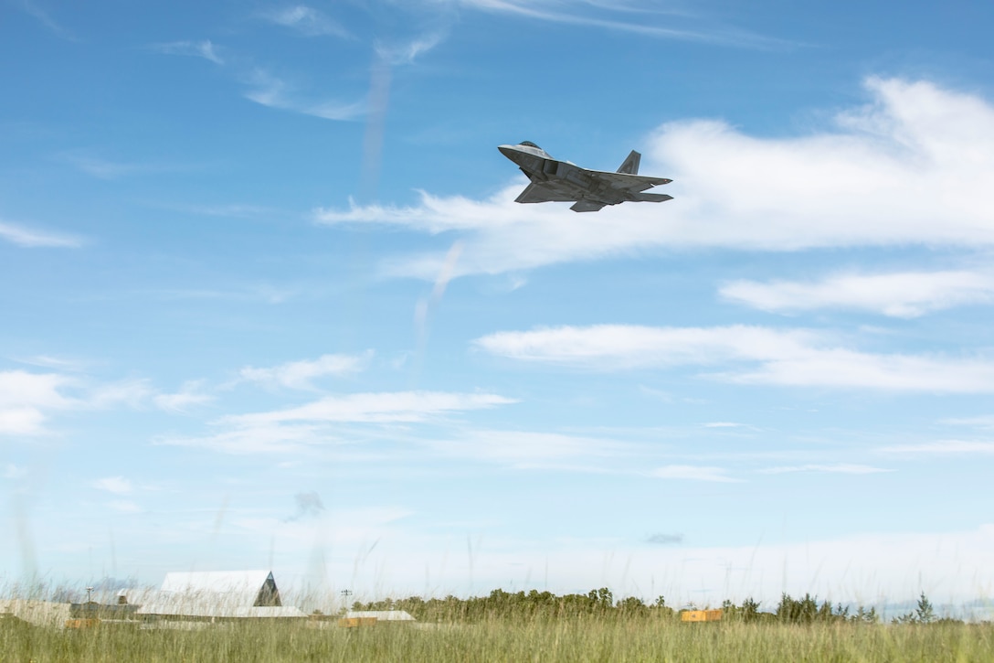 A U.S. Air Force F-22 Raptor assigned to the 27th Fighter Squadron, prepares to land at Palau International Airport during exercise Valiant Shield 24 at Airai, Palau, June 12, 2024. Valiant Shield enables real-world proficiency in sustaining joint forces through detecting, locating, tracking and engaging units at sea, in the air, on land and in cyberspace in response to a range of mission areas. I Marine Expeditionary Force consistently engages in exercises with allies and partners across the Indo-Pacific region to bolster regional security, maintain access and advance a free and open Indo-Pacific. (U.S. Marine Corps photo by Sgt. Nello Miele)