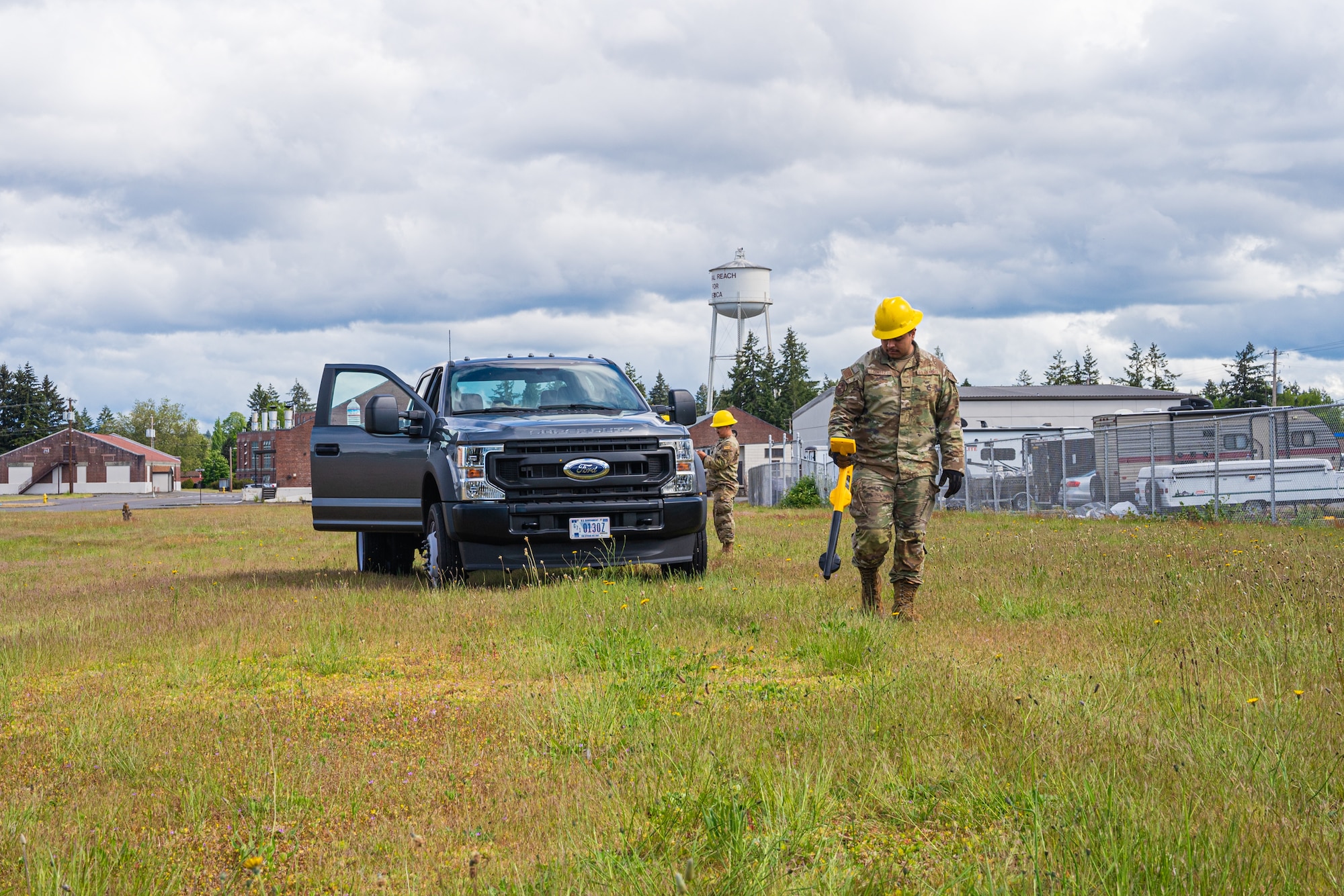 U.S. Air Force Senior Airman Angel Cortez, a cable and antenna systems technician with the 627th Communications Squadron, scans for underground cables at Joint Base Lewis-McChord, Washington, May 28, 2024. Cable and antenna systems Airmen are required to take safety precautions while working in the field. (U.S. Air Force photo by Airman 1st Class Benjamin Riddle)