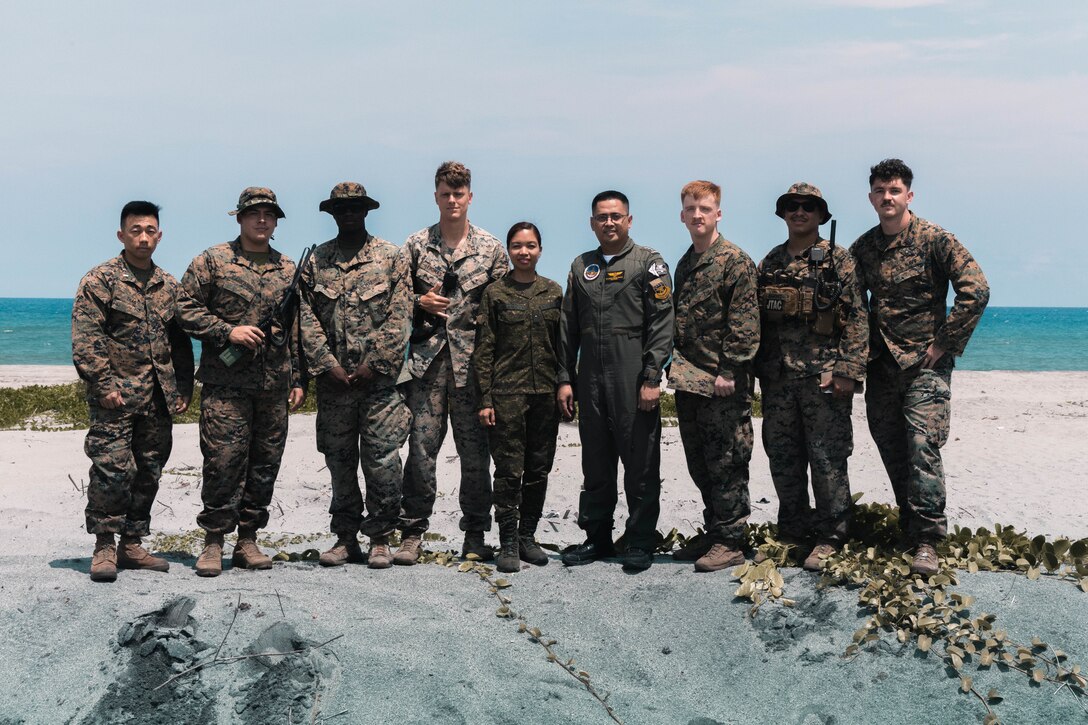 U.S. Marines with I Marine Expeditionary Force (Forward), and Philippine Marines pose for a photo during the littoral live-fire exercise for Marine Aviation Support Activity 24 at San Antonio, Zambales, Philippines, June 15, 2024. The LLFX showcased the integrated command and control capabilities of the U.S. and Philippine armed forces in a territorial defense scenario featuring a coordinated bilateral surface and maritime strike. MASA is an annual Philippine-U.S. military exercise focused on mutual defense, strengthening relationships, and rehearsing emerging aviation concepts. (U.S. Marine Corps photo by Cpl. Christian Tofteroo)