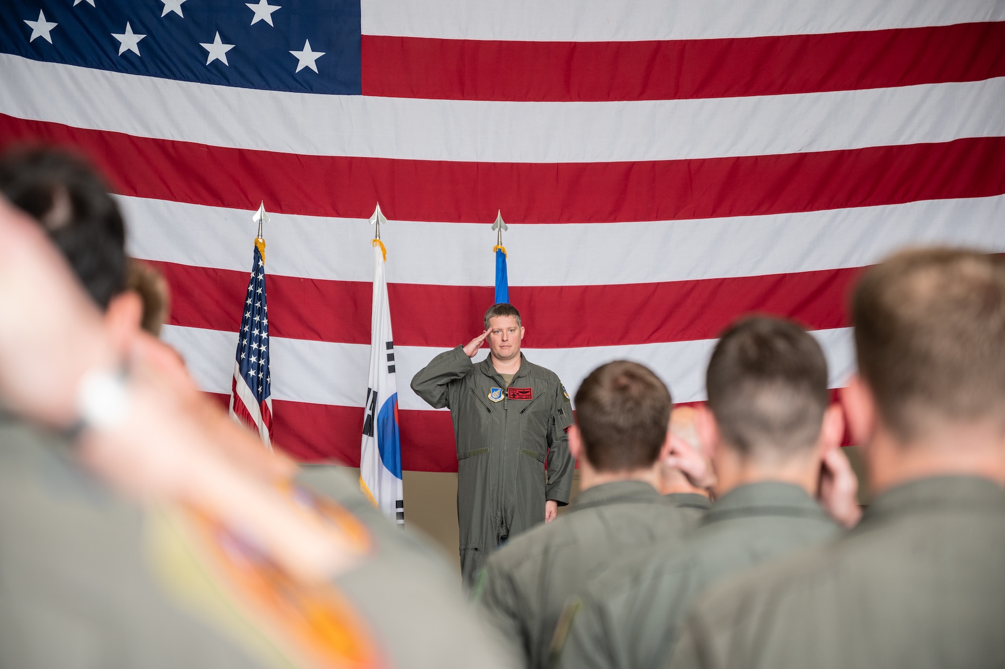 U.S. Air Force Lt. Col. Eric Foster, 36th Fighter Squadron commander, renders his first salute to Airmen from the 36th FS during a change of command ceremony at Osan Air Base, Republic of Korea, June 24, 2024. The 36th FS is a combat ready squadron with the capability to conduct air interdiction, close air support and counter-air missions in both day and night conditions. (U.S. Air Force photo by Staff Sgt. Christopher Tam)