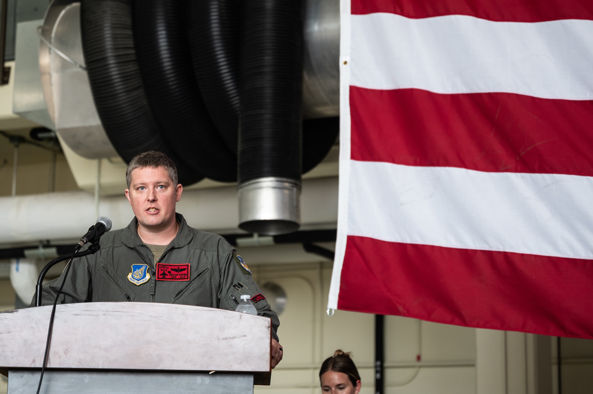 U.S. Air Force Lt. Col. Eric Foster, 36th Fighter Squadron commander, gives his first speech to his squadron during a change of command ceremony at Osan Air Base, Republic of Korea, June 24, 2024. Foster will lead the 36th FS in train to tactics and enable combat operations for the air interdiction, suppression of enemy air defenses, defensive counter air and close air support missions. (U.S. Air Force photo by Staff Sgt. Christopher Tam)
