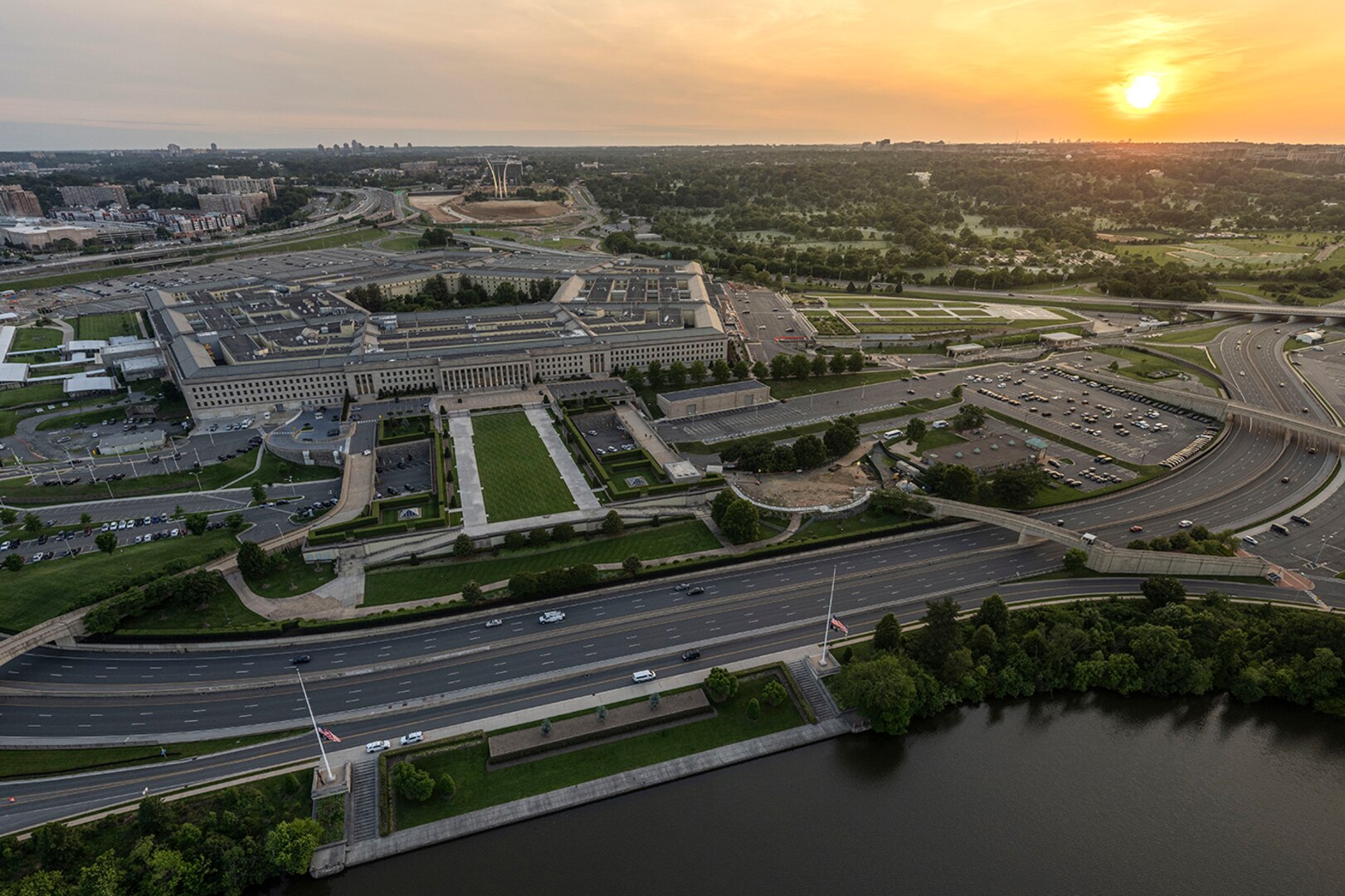Aerial view of a five-sided building photographed at twilight.