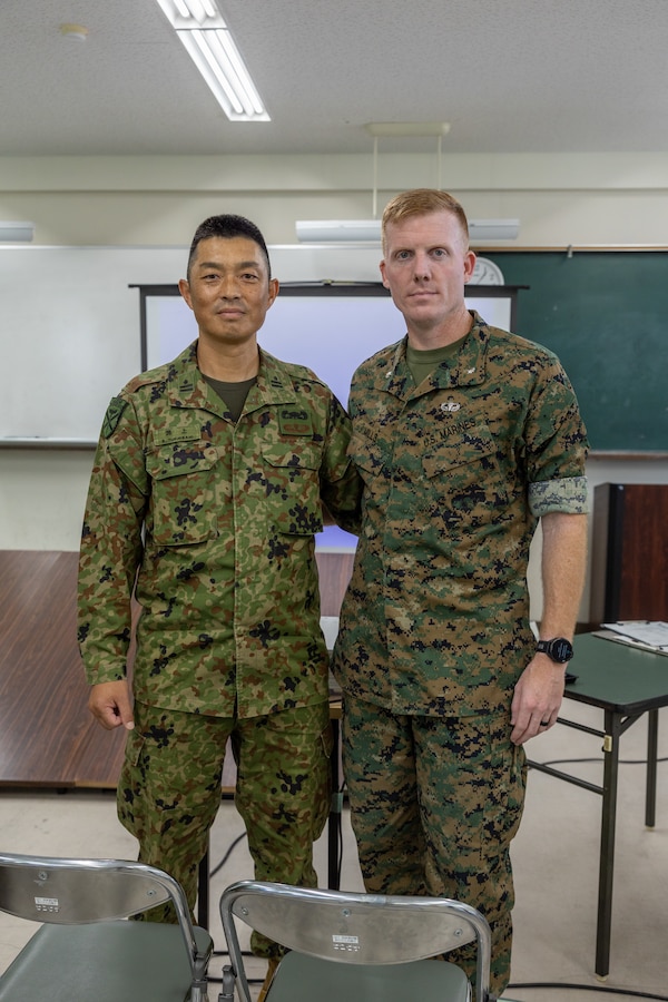 Japan Ground Self Defense Force Maj. S. Fuchikami, left, training officer with 1st Amphibious Rapid Deployment Regiment, and U.S. Marine Corps Lt. Col. Kirby Mills, operations officer with the 31st Marine Expeditionary Unit, pose for a picture during a staff exercise on Camp Ainoura, Sasebo, Japan, June 13, 2024. The staff exercise prepared both armed forces for cooperative humanitarian assistance and operations. The 31st MEU, the Marine Corps’ only continuously forward-deployed MEU, provides a flexible and lethal force ready to perform a wide range of military operations as the premier crisis response force in the Indo-Pacific region. (U.S. Marine Corps photo by Lance Cpl. Peter J. Eilen)