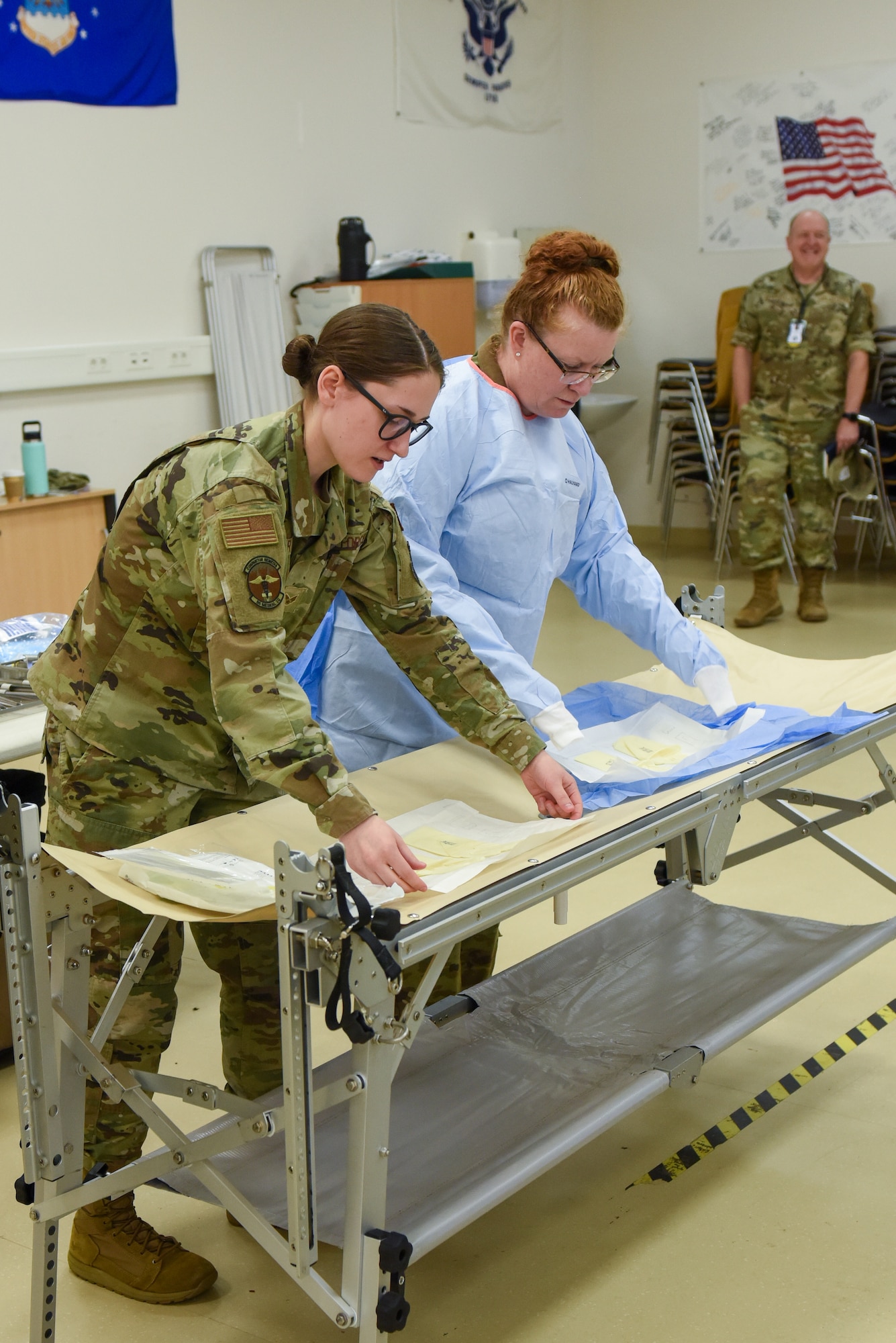 People practice preparing surgical equipment