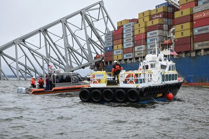 U.S. Coast Guard and partner agency boat crews work together in the Patapsco River April 2, 2024 during the Francis Scott Key Bridge response in Baltimore, Maryland.