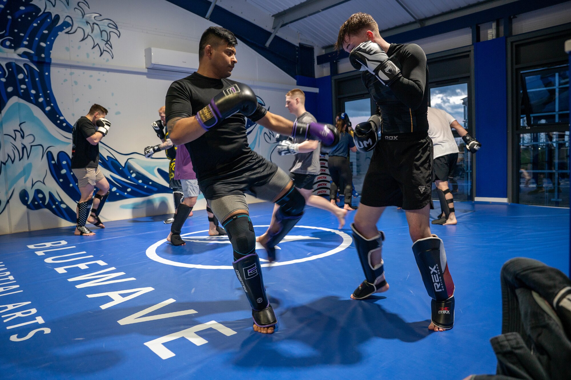 48th Security Forces Squadron Airman instructs a kickboxing session
