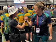 U.S. Army Capt. Hannah Wright, left, and Australia Army Sgt. Emily Lahey congratulate each other at the powerlifting competition