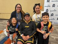 U.S. Army Sgt. 1st Class Jack Peko and family take a break in between precision air competitions at the 2024 Department of Defense Warrior Games