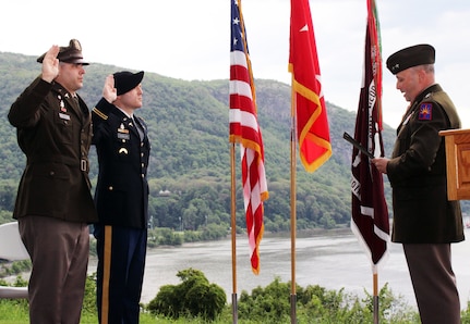 New York Army National Guard 1st Lts. Adrian Smith, left, and John Gamalski are administered the oath of office by Maj. Gen. Michel Natali, the assistant adjutant general, Army for the New York National Guard, at the U.S. Military Academy at West Point June 7, 2024. The two men were recognized for completing the Interservice Physician's Assistant Program with their degrees and promotions to first lieutenant.