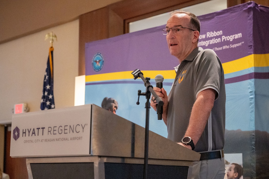 Photo of Lt. Gen. Healy speaking at a podium.