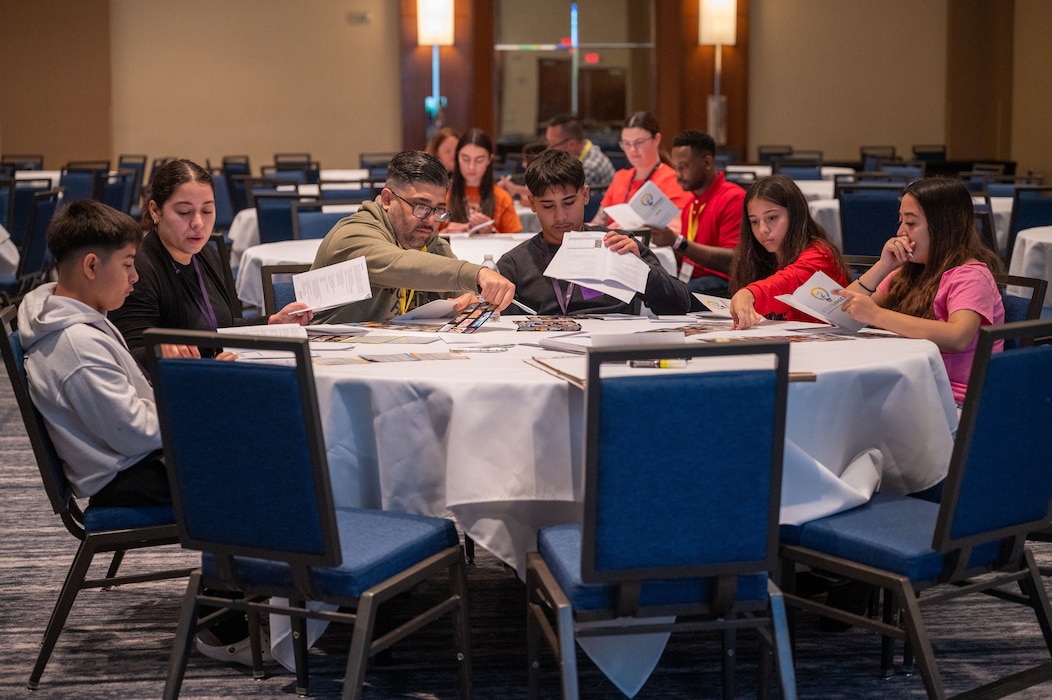 Photo of a family engaging in an exercise at a table