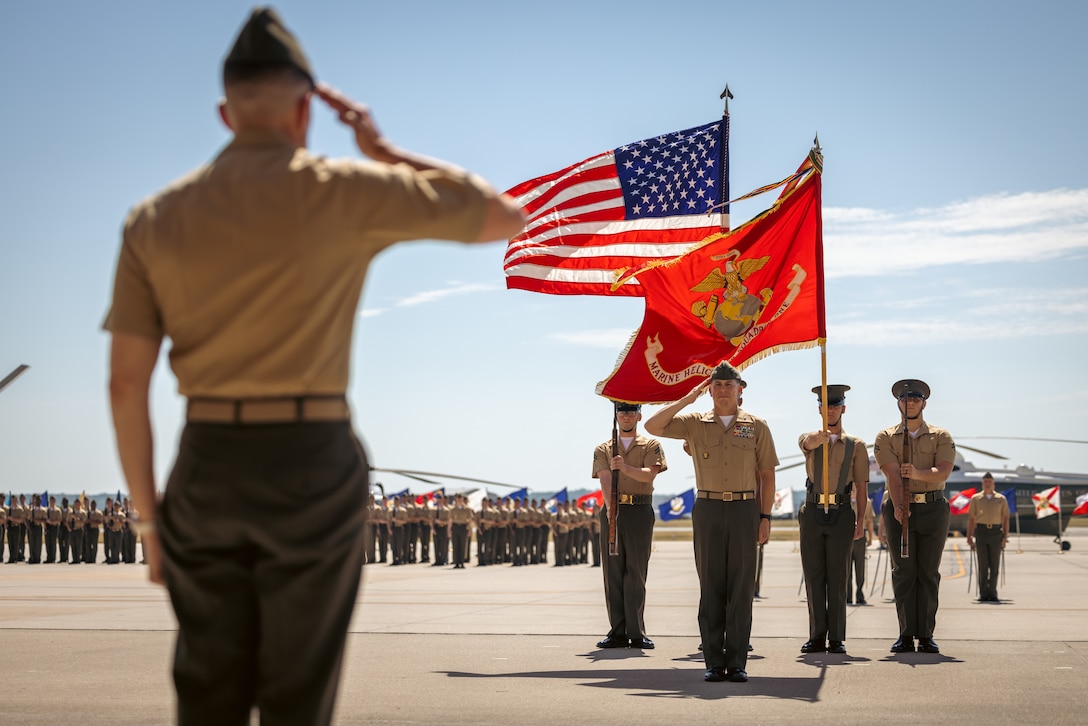 U.S. Marine Corps Col. Bradley Harms, the outgoing commanding officer of Marine Helicopter Squadron One, right, renders a salute during a change of command ceremony on Marine Corps Base Quantico, Virginia, June 21, 2024. Harms was relieved by Col. Ryan Shadle after being in command since December of 2021. (U.S. Marine Corps photo by Lance Cpl. Joaquin Dela Torre)