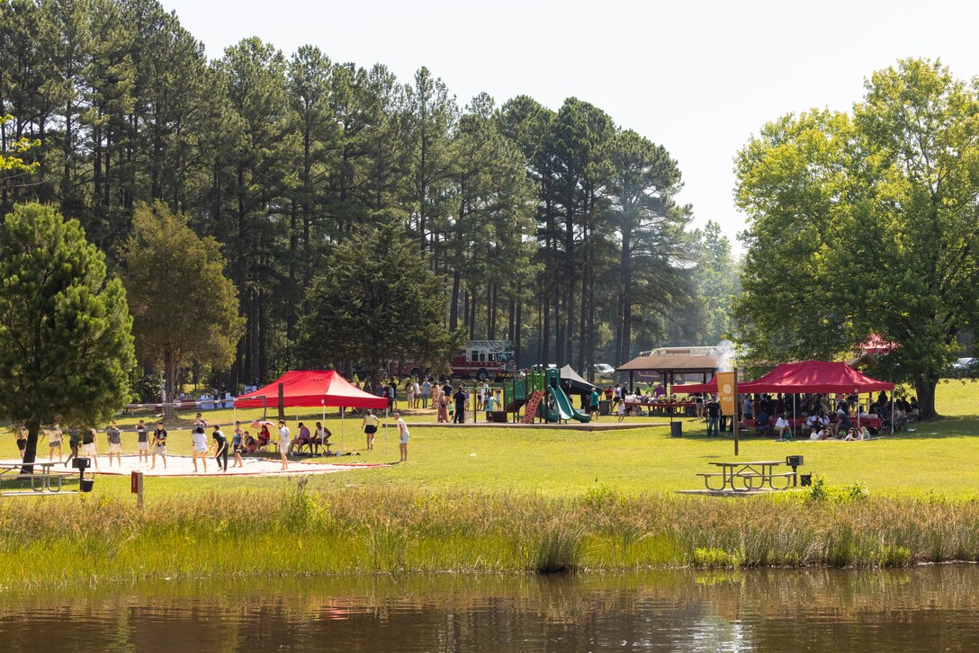 U. S. Marines and family members of Security Battalion attend a family day event at Lunga Park, Quantico, Virginia on June 14, 2024. The event hosted the unit’s Marines and family members to build unit cohesion and comradery through games, food and drinks, and other various resource vendors to promote healthy lifestyles. (U.S. Marine Corps photo by Cpl. Darien Wright)