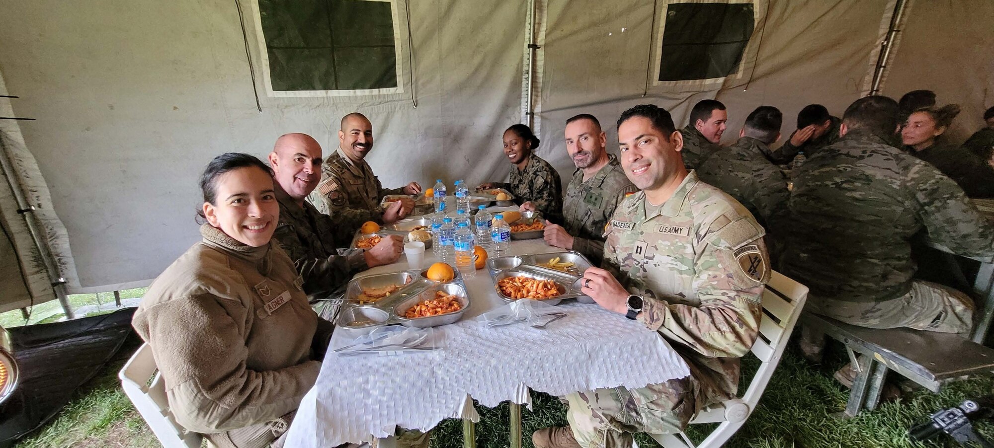 Staff Sgt. Vanesa Wagner eats lunch with instructors and fellow service members at the Spanish Artillery Academy in Sergovia, Spain, while learning how Artillery officer cadets prepare to conduct an Artillery exercise in the field. Wagner participated in a Language Intensive Training Event (LITE) at the academy in early 2024.