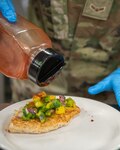 The 138th Fighter Wing Services Flight prepares a meal for an Airmen luncheon with Chief Master Sgt. Maurice Williams, command chief, Air National Guard, Feb. 4, 2023, at Tulsa Air National Guard Base, Okla. Services Flight is responsible for planning, preparing, and cooking meals for Airmen. This includes breakfast, lunch, and dinner, ensuring they are nutritious, balanced, and meet Air Force standards. (Oklahoma Air National Guard photo by Master Sgt. C.T. Michael)